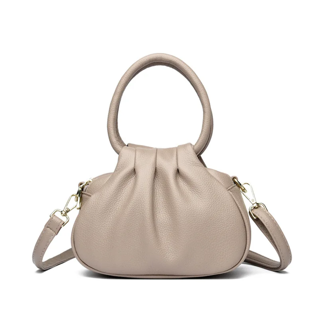 Elegant Handbag
A chic and versatile handbag featuring a stylish top handle, adjustable shoulder strap, and elegant gold-tone details. Perfect for everyday wear or special occasions.
Chic • Elegant • Versatile